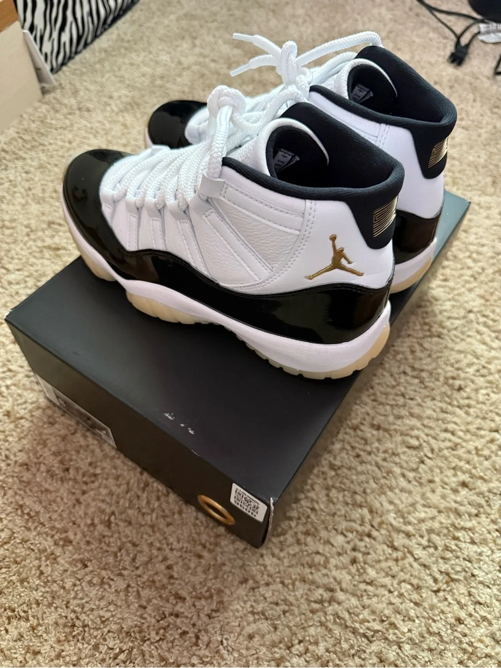 Air Jordan 11 Retro White Black Gold Sneakers